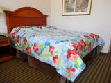 here is what the quilt looks like on an actual bed. It gives you an idea of where the border drapes.